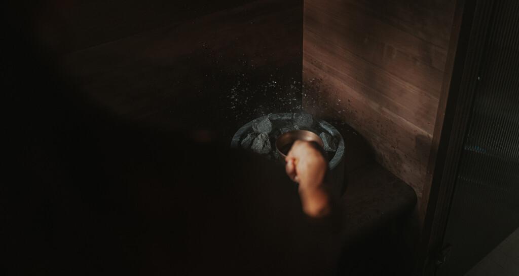 Throwing water on a Tulikivi sauna heater